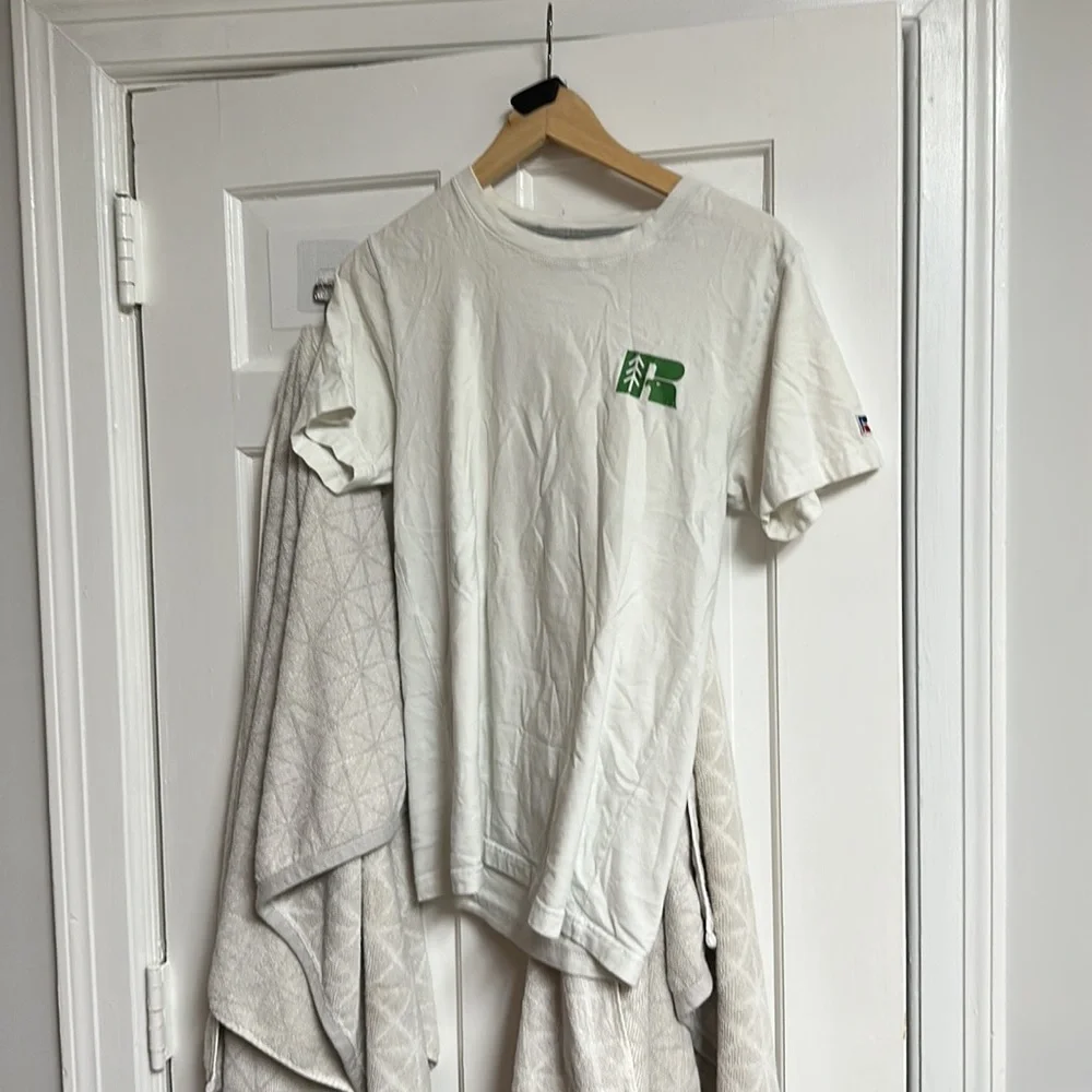 The brand is Russell and the size is small and is white with green and blue. - Picture 1 of 6